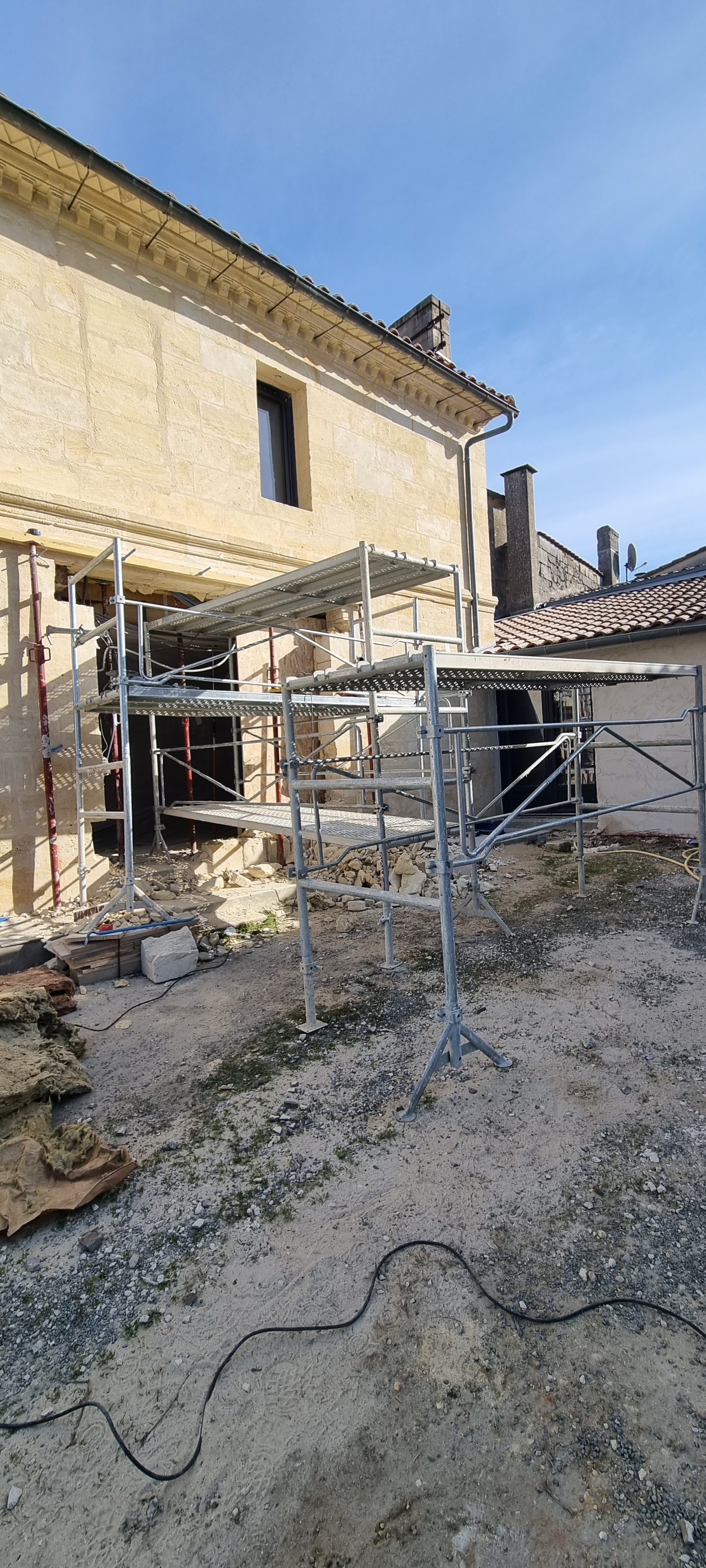 Ouverture mur pierre de taille en façade