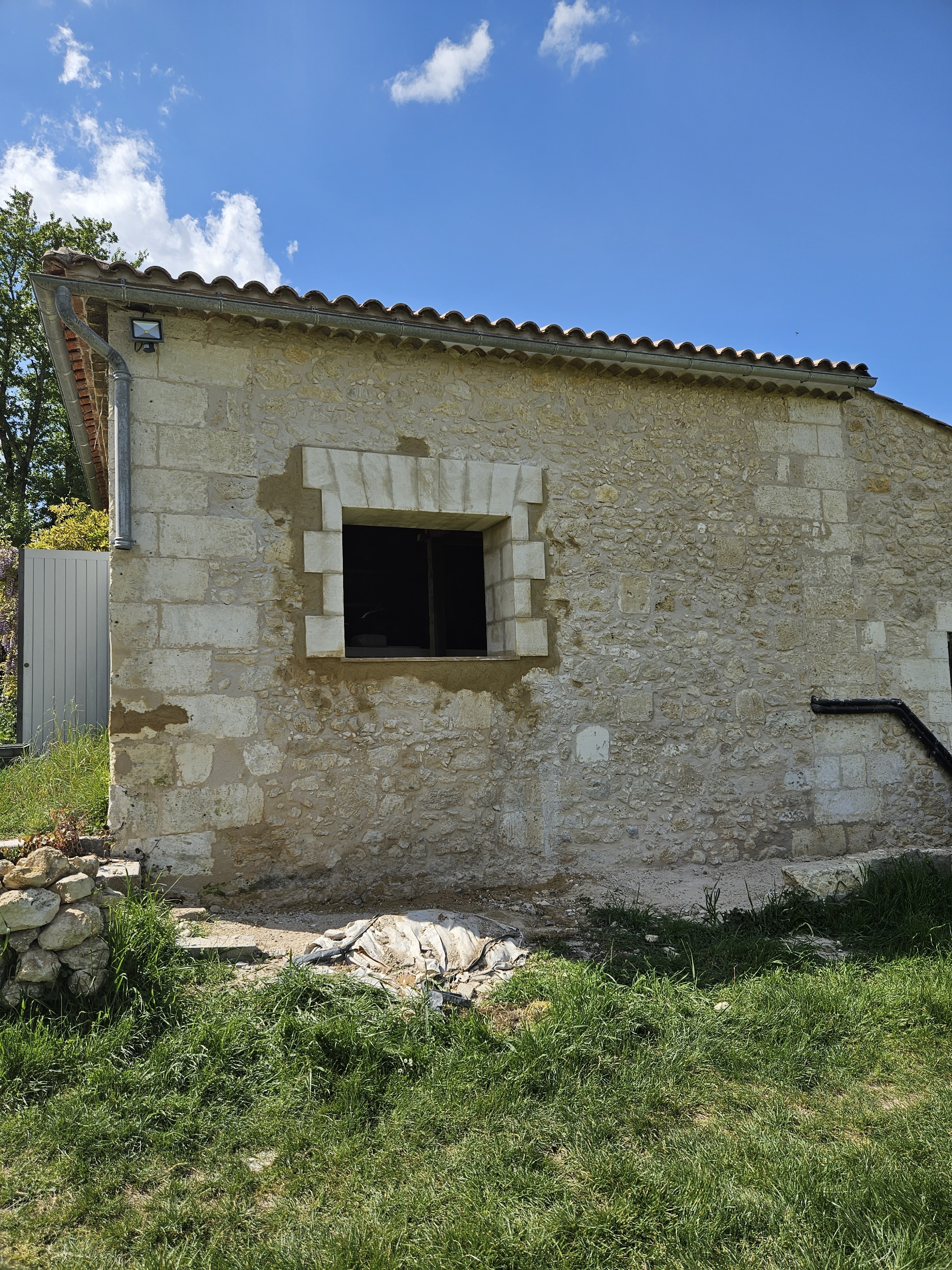 Ouverture mur en moellon placage pierre