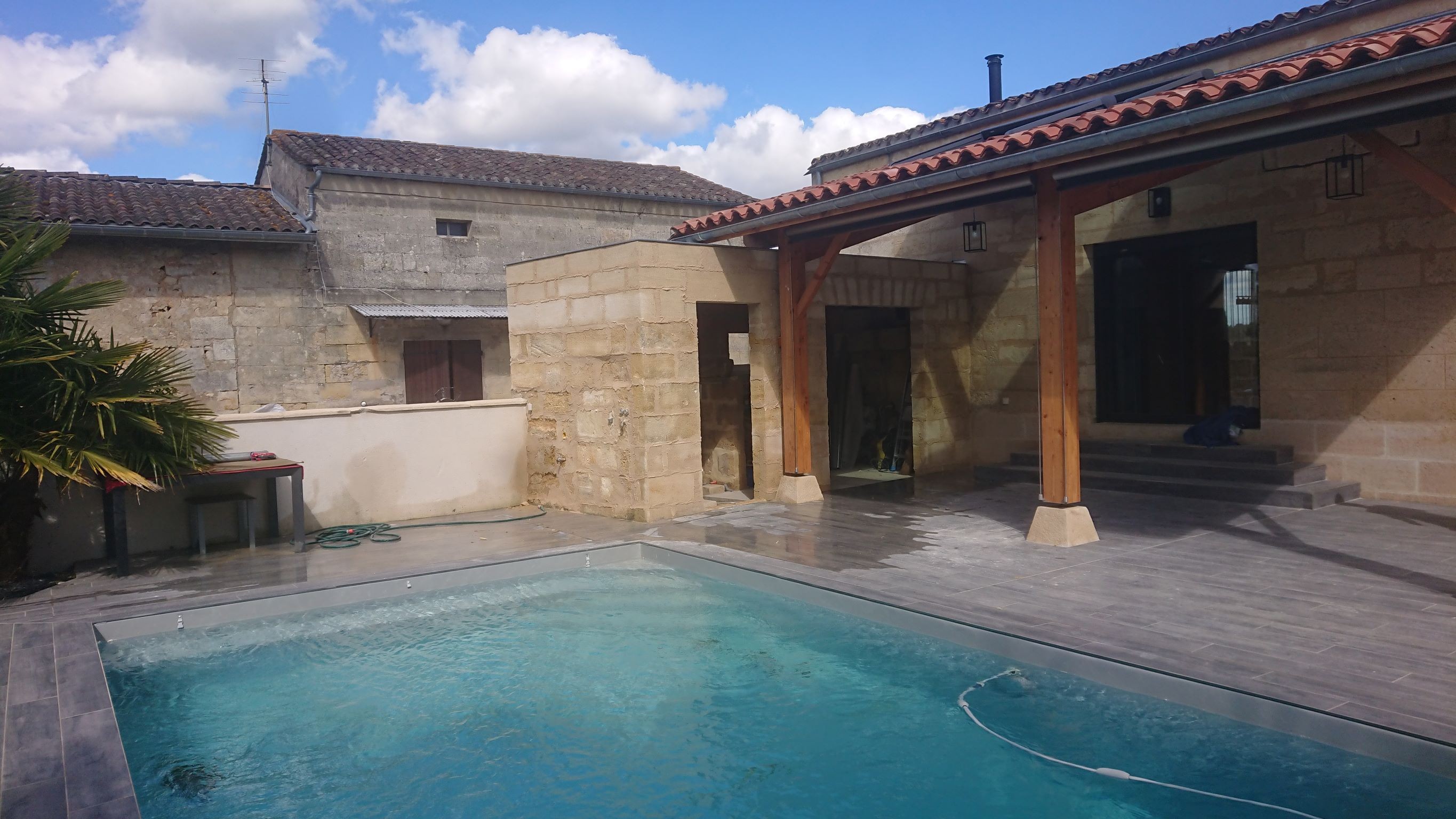 Restauration et réhausse en brique et pierre de taille